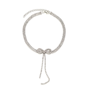 Silver bowknot necklace with shimmering rhinestones and elegant fringe tassels