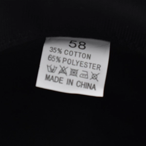 Detail view of the inner care label showing 35% cotton, 65% polyester and size 58