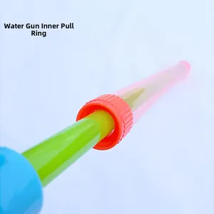 Detail of the internal pull ring and piston mechanism in a colorful kids' water squirt gun