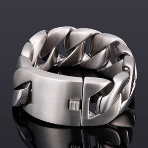 Detail shot of heavy matte titanium steel Cuban chain bracelet with a secure clasp