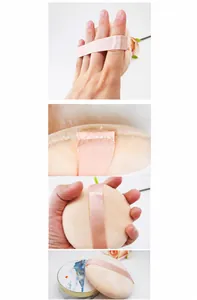 Detail of 9cm large makeup powder puff showing 15mm wide ribbon strap and soft texture