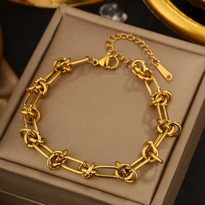 Close-up of gold-plated stainless steel twist chain bracelet with a secure lobster clasp