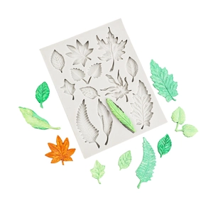 Siliconen mal voor tropische bladeren en bloemen met groene en oranje fondant decoraties