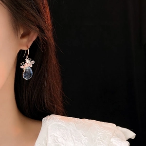 Elegant gold drop earrings with blue teardrop gems and pink floral zircon stones