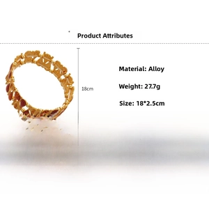Detailed specs of retro alloy bracelet featuring red enamel details and hollow engraving