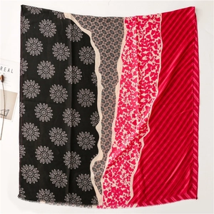 Detailed pattern overview of a floral patchwork scarf with vibrant red and black motifs