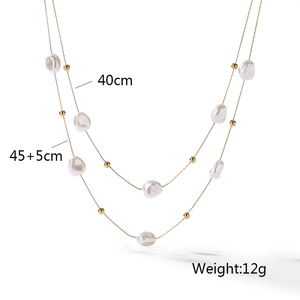 Double-layered gold chain necklace featuring baroque pearls with size and weight details