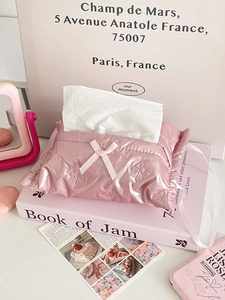 Detailed view of pink bow tissue box with metallic quilted fabric and hanging ribbon