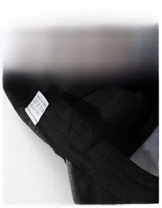 Detail view of cotton baseball cap interior with moisture-wicking widened sweatband