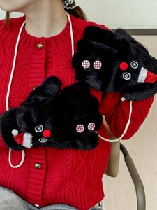 Close-up of black plush snowman gloves with red hat and hanging string detail