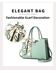 Detail of light green tote bag featuring a leather texture and elegant silk scarf handle