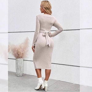 Elegant apricot maternity knit dress featuring long sleeves and slim fit waist tie