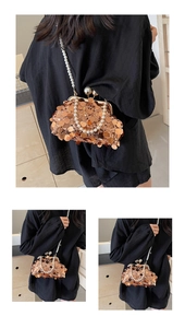 Detail of sequin evening bag with pearl strap and bronze gold metallic finish