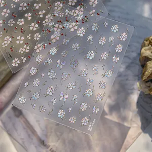 Macro shot of ultra-thin metallic floral nail stickers with TO-532R peony and cherry designs