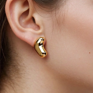 Polished gold bean shaped stud earrings in a geometric asymmetric style for women