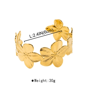 Detail view of golden floral cuff bracelet showing 2.4-inch inner diameter and 30g weight
