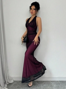 Detail of plum mesh V-neck bodycon dress featuring elegant black tulle mermaid hemline