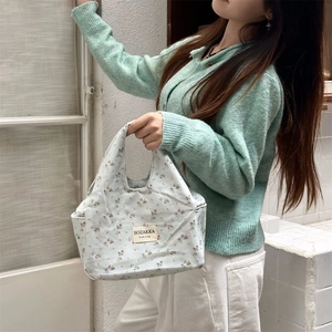 Floral canvas lunch bag with blue flower pattern and top handles for daily office use