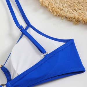 Detail of royal blue bikini back with adjustable straps and breathable white mesh lining