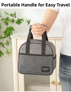 Close-up of portable gray insulated lunch bag with reinforced handle for daily commute