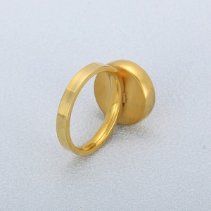 Minimalist gold screw thread stainless steel ring with flat circular geometric surface