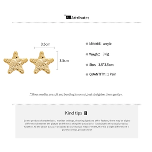 Detailed view of 3.5cm gold star earrings with acrylic material and silver needle