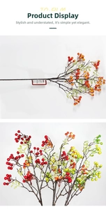 Detailed view of artificial red berry branches with glossy multi-color gradient fruit