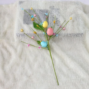 Close-up of Easter egg floral stems with faux pearls and pastel speckled eggs décor