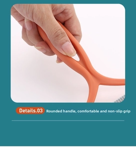Ergonomic orange handle of manual lint remover with comfortable non-slip grip