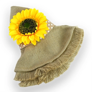 Detailed macro view of a rustic sunflower decoration on a natural burlap linen hat band