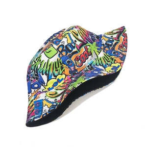 Detail of street graffiti bucket hat featuring vibrant pop art prints and black lining
