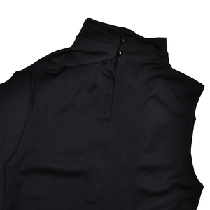 Close-up of mock neck back detail with two black buttons on a sleeveless top
