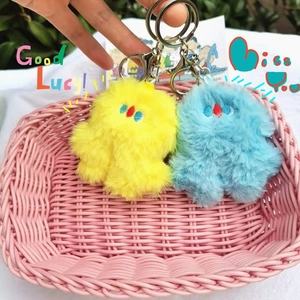 Cute plush monster bag charm set with soft long fur and silver metal keychains