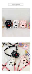 Detail view of colorful 3D silicone cat crossbody purses with adjustable printed straps
