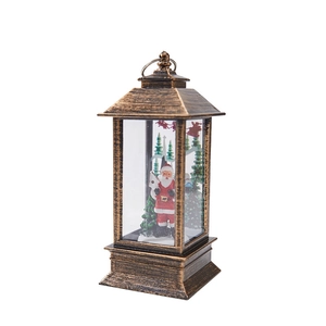 Vintage bronze Christmas lantern ornament featuring Santa Claus and a reindeer silhouette