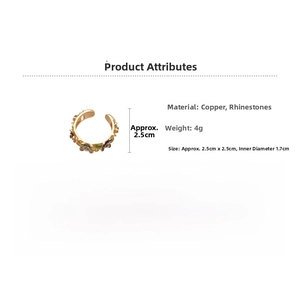 Detail view of flower ring showing gold-plated copper material and rhinestone inlay