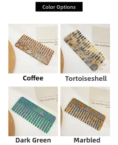 Close-up of vintage acetate wide-tooth hair combs in floral and tortoiseshell patterns