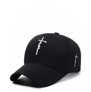 Close-up of white faith cross embroidery on black cotton baseball cap with ventilation holes
