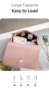 Detail view of pink crossbody bag interior showing storage for lipstick and mascara