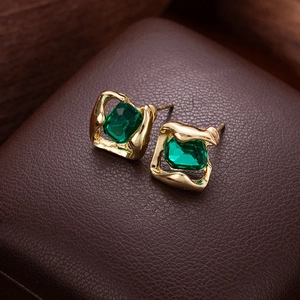 Vintage French emerald green crystal stud earrings with irregular gold finish metal setting