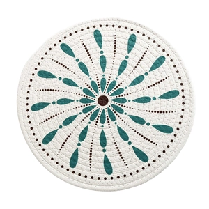 Round bohemian woven cotton placemat with blue and brown mandala print on white background