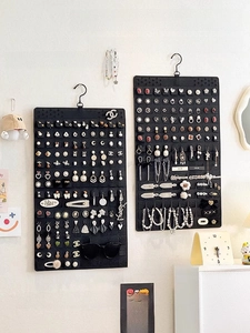 Detail of double-sided felt jewelry organizer with a 360-degree rotating metal hook