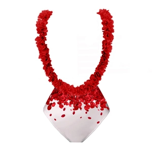 Detail of red floral lei and white bikini bottom with layered rose petal print