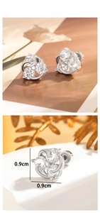 Detailed view of silver flower stud earrings with three clear zircons and 0.9cm dimensions