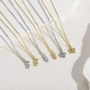 Elegant bear and elephant zircon pendants in gold and silver finish on delicate chains