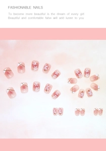Detail of short square camellia press-on nails in pink and purple with floral patterns