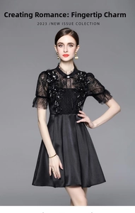 Close-up of black lace patchwork dress with sequin details and a high waist A-line silhouette