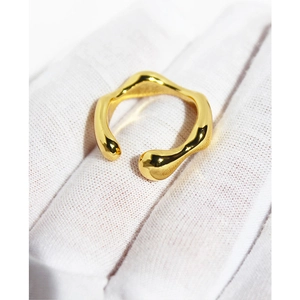 Minimalist irregular wave pattern adjustable open ring in gold finish on white background