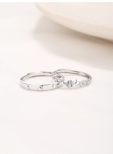 Macro shot of S925 sterling silver couple rings with sparkling cubic zirconia stones