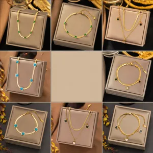 Detailed close-up of gold-plated necklace and bracelet sets with colorful gemstones